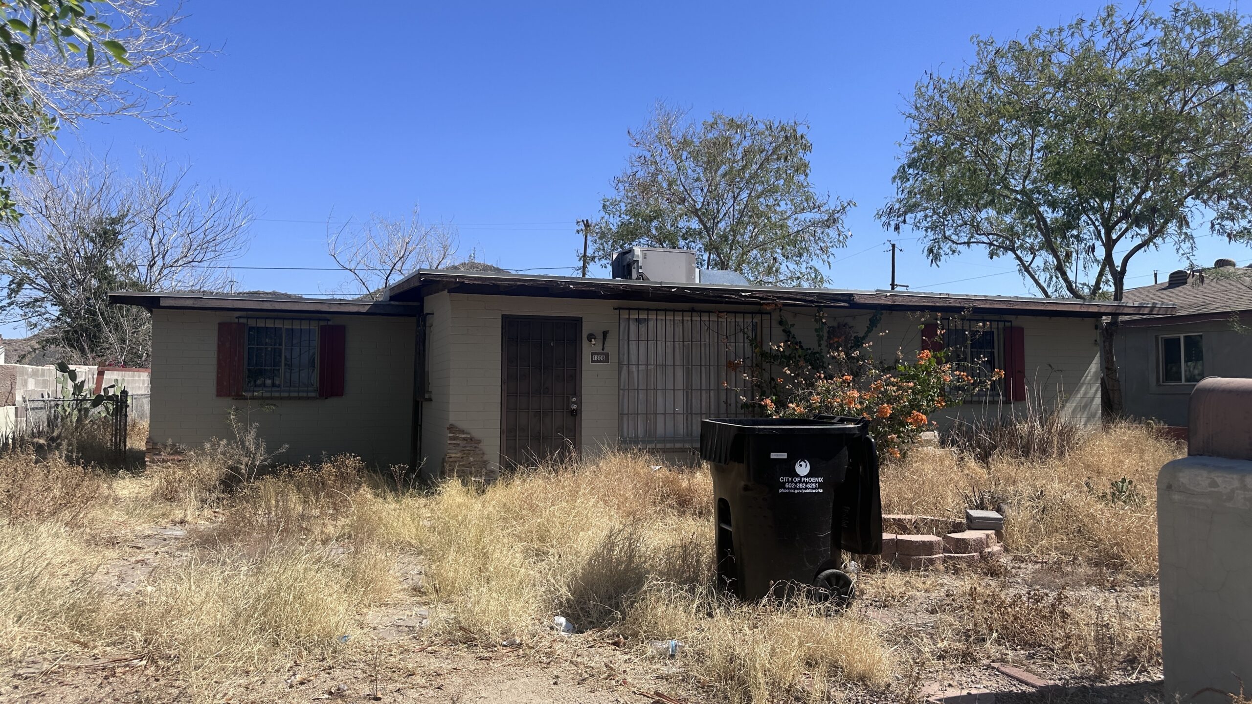 Actual distressed Phoenix house purchased by Shrubby with deferred exterior maintenance Actual distressed Phoenix house purchased by Shrubby with deferred exterior maintenance